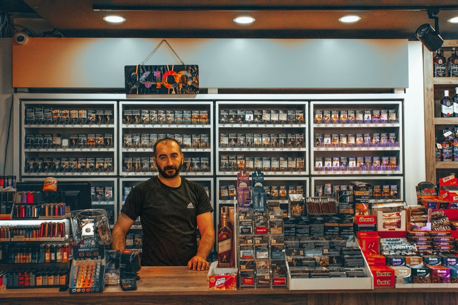 Customer asking at a dispensary counter for craft cannabis by name